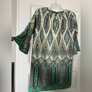 Green dress with 3/4 bell sleeves.